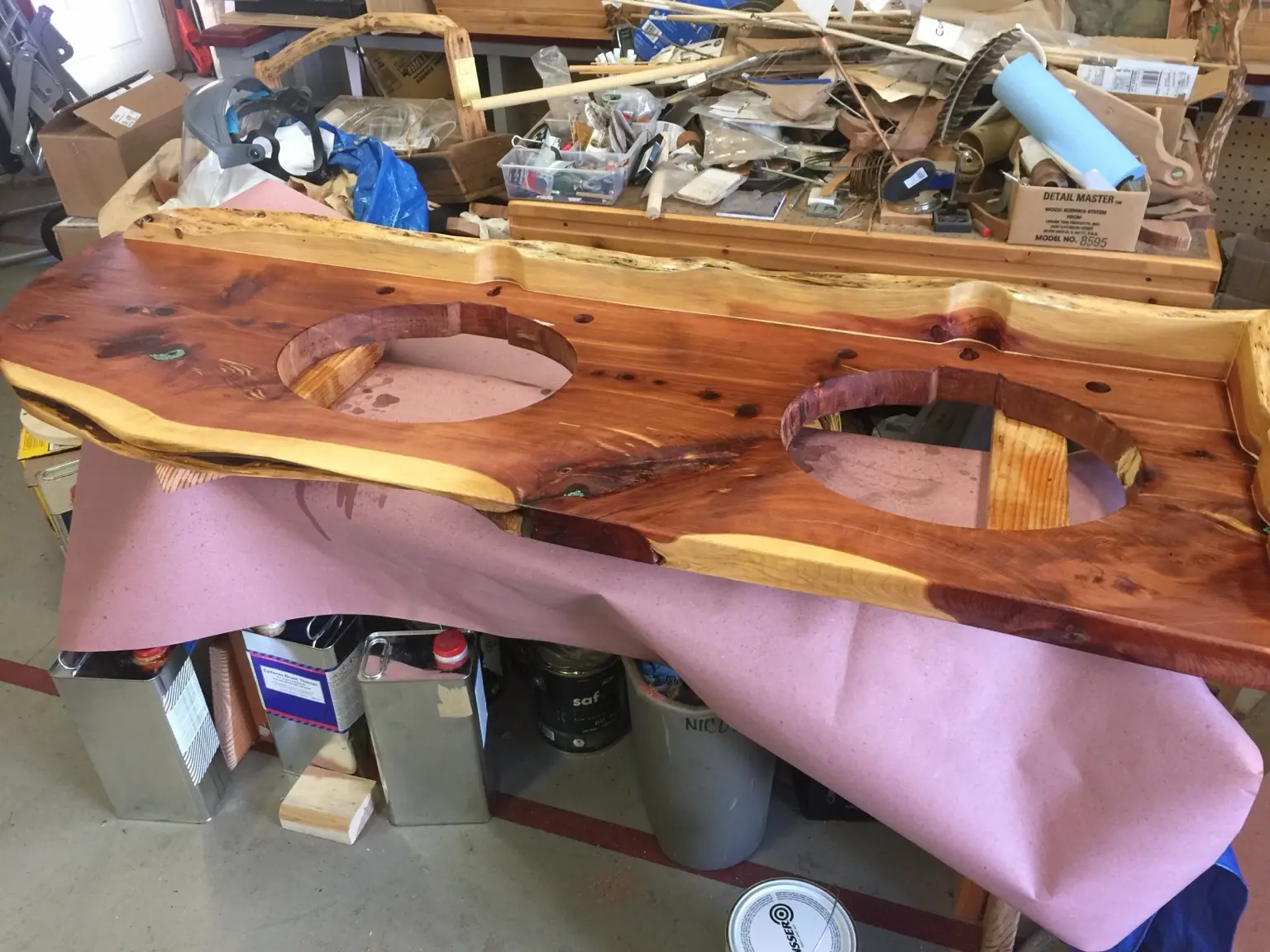 Live-edge cedar double-vanity countertop with sink openings during fabrication
