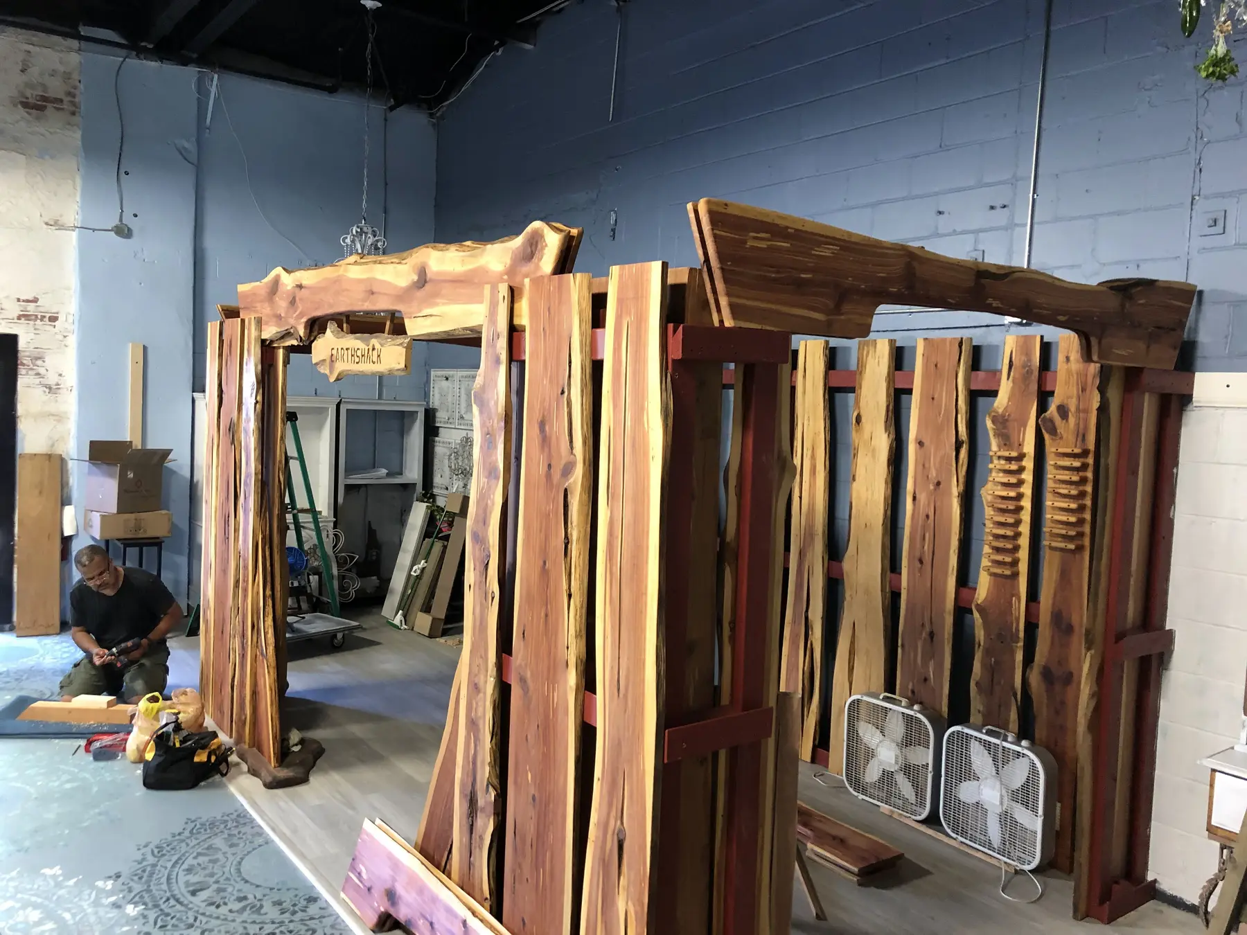 Side view of the live-edge Earth Shack retail display during construction