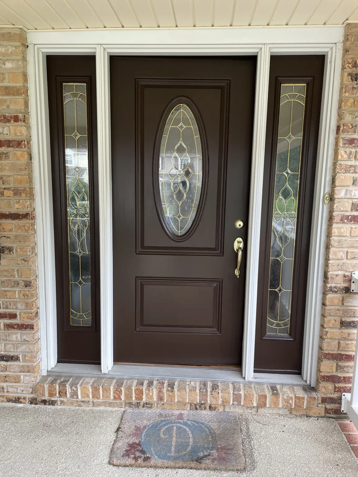 Freshly refinished front door and sidelights