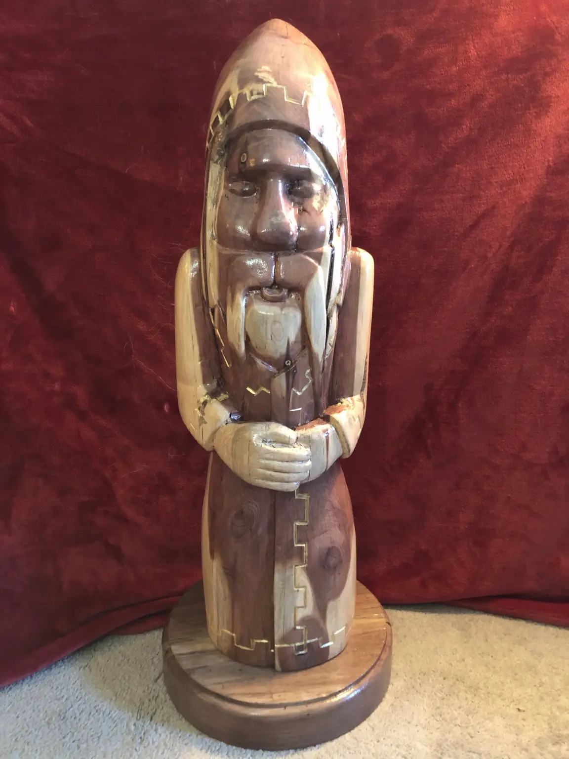 Handcrafted wooden figure with contrasting wood inlay