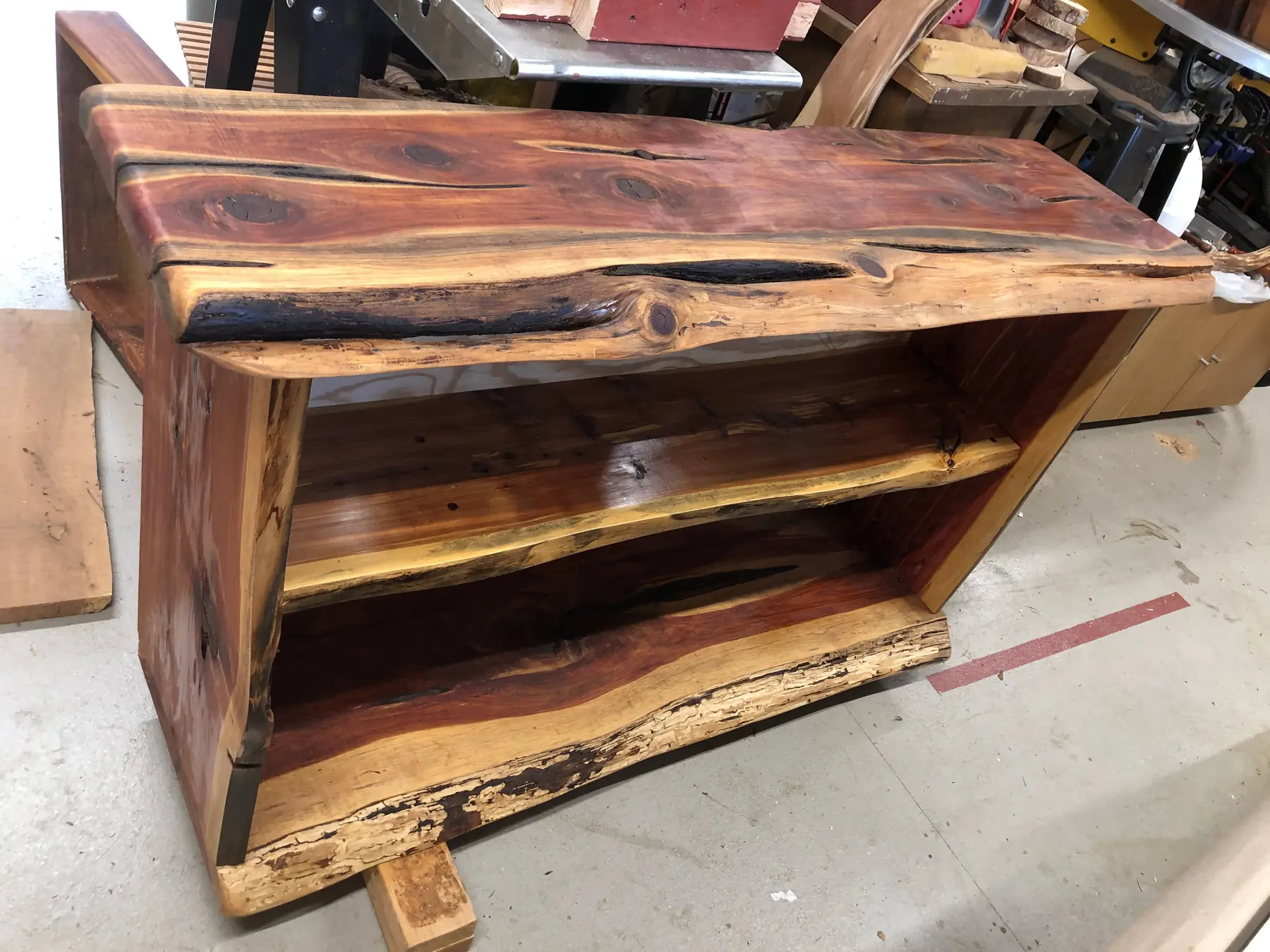 Handcrafted live-edge cedar bookcase with two shelves