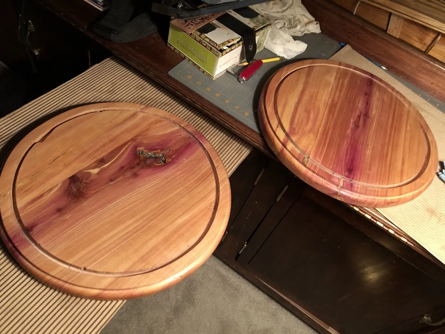 Two handcrafted round cedar serving trays